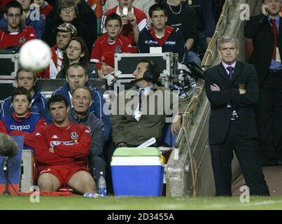 Wales' Manager Mark Hughes (right) stands watching with dejection with captain Gary Speed on the bench (front left) during the World Cup qualifier at the Millennium Stadium, Cardiff.   THIS PICTURE CAN ONLY BE USED WITHIN THE CONTEXT OF AN EDITORIAL FEATURE. NO WEBSITE/INTERNET USE UNLESS SITE IS REGISTERED WITH FOOTBALL ASSOCIATION PREMIER LEAGUE. Stock Photo