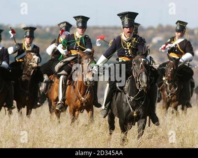 A re-enactment of the 17th Lancers 'Charge of The Light Brigade' through The Valley of Death wearing Drill Order of  Brigade in The Crimea, Ukraine. The 150th Anniversary of the famous battle is tomorrow. 25/10/2004  The Duke of Edinbrugh will take part in commemorations to celebrate the 150th anniversary of the famous battle Stock Photo