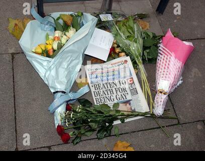 Floral tributes and an Evening Standard newspaper for David Morley on the south Bank, London. David Morley 37, a survivor of the Soho nail bombing, was beaten to death in an apparently homophobic attack at the weekend. He died at the hands of teenage thugs - including two girls - who carried out a savage spate of street attacks near the Royal Festival Hall in central London. Stock Photo