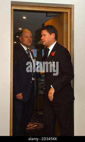 Arriving together, sporting director Frank Arnesen, right, and Martin Jol, who was announced as the new head coach of Tottenham Hotspur FC at a press conference at White Hart Lane, north London. The former Dutch international player replaces Jacques Santini, who stood down on Friday. Stock Photo