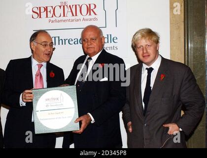 Tory leader Michael Howard presents Sir Peter Tapsell MP with his 'Spectator Parliamentarian of the Year Award' watched by Spectator editor Boris Johnson at the awards ceremony in central London. Stock Photo