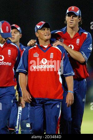 England's Darren Gough (centre) shows his dejection as team-mate Kevin Pietersen (right) consoles him following the three wicket defeat. Stock Photo
