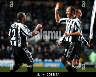 Newcastle United's Alan Shearer (right) celebrates with team-mate Stephen Carr after scoring the second goal against Heerenveen. Stock Photo