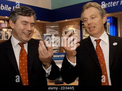 Chancellor Gordon Brown (left) and Prime Minister Tony Blair attempt to take photos of each other. Stock Photo