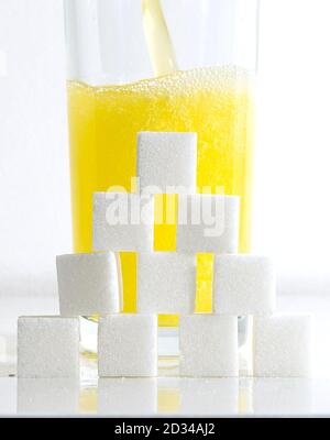 An orange carbonated drink with sugar cubes as drinking sugary drinks could be causing nearly 8,000 cases of type 2 diabetes a year, according to research. Stock Photo