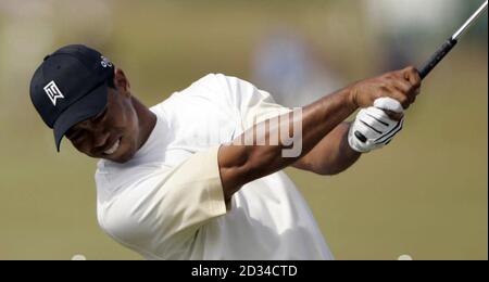 Tiger Woods hits a tee shot on the 4th hole in the third round at the ...