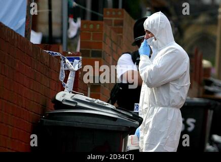 Police forensic officers continue to work at a house in Colwyn Road in Leeds. A father of two spoke today of his 'utter devastation' on finding that his next-door neighbour was a London suicide bomber. The taxi driver, 37, who spoke on condition of anonymity, lived next door to Shehzad Tanweer and his family, after moving five years ago to Colwyn Road in Beeston, Leeds. The neighbour, who is from Yorkshire and not of Asian origin, said he never imagined the 'polite, educated boy' who lived next door was one of the bombers. Stock Photo