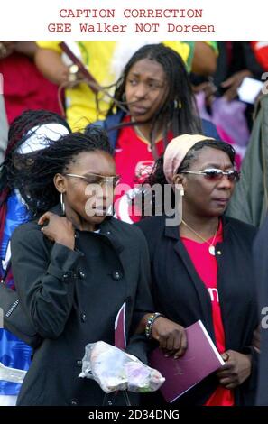 RETRANSMITTED WITH CORRECT CAPTION GEE Walker not Doreen. Gee, the mother of murdered teenager Anthony Walker (R) leaves Liverpool Cathedral following his funeral Thursday August 25, 2005. The 18-year-old student was bludgeoned with an axe in a park in Huyton, Merseyside, last month. The devout Christian's funeral is taking place at Liverpool's Anglican Cathedral. The service is open to the public and Anthony's family have asked the congregation to wear football shirts. A spokesman for the Walker family said: 'We don't want the occasion to be sombre, but rather wish it to be a joyful thanksgi Stock Photo