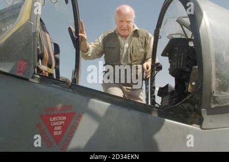 Britain's Defence Secretary John Reid climbing into a Harrier at the GR7 detachment in Kandahar, Afghanistan, Monday October 3, 2005, as part of a trip to visit British forces within Afghanistan. See PA Story DEFENCE Afghanistan. PRESS ASSOCIATION Photo. Photo credit should read: Johnny Green/PA Stock Photo