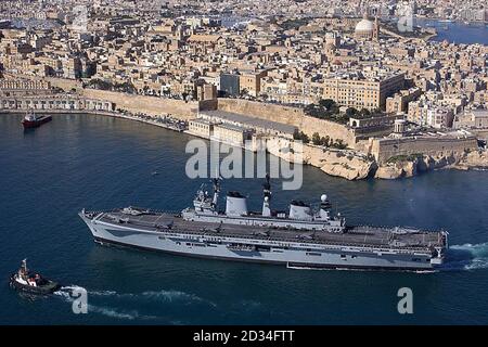 Previously un issued picture dated 20/11/05 of HMS Illustrious arriving in the Grand Harbour, Valetta, Malta in advance of Britain's Queen Elizabeth II's visit to the island. The Queen will arrive in Malta Wednesday 23 November 2005 for a four-day stay on the tiny Mediterranean island amid tight security. Her first visit to the archipelago for 13 years will include the opening of the Commonwealth leaders' summit later this week. It will be the Queen's first overseas trip since the July 7 bombings in London. See PA Story ROYAL Malta. PRESS ASSOCIATION Photo. Photo credit should read: Russell-St Stock Photo