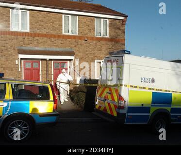 A police forensic officer searches a house in Lambersart Close, near Southborough in Kent, Sunday February 26, 2006, as the search for the Securitas depot robbers continues. Detectives investigating the multi-million pound raid today said they had carried out a 'number of raids' overnight as the net closes in on the robbers. Kent Police also said it had made a sixth arrest in connection with the inquiry. The man aged 49, who was held yesterday, was later released on bail. See PA story POLICE Robbery. PRESS ASSOCIATION photo. Photo credit should read: Michael Stephens/PA. Stock Photo