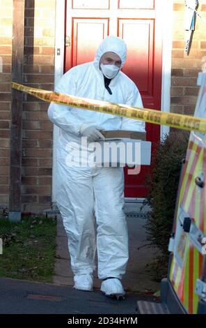 A police forensic officer searches a house in Lambersart Close, near Southborough in Kent, Sunday February 26, 2006, as the search for the Securitas depot robbers continues. Detectives investigating the multi-million pound raid today said they had carried out a 'number of raids' overnight as the net closes in on the robbers. Kent Police also said it had made a sixth arrest in connection with the inquiry. The man aged 49, who was held yesterday, was later released on bail. See PA story POLICE Robbery. PRESS ASSOCIATION Photo. Photo credit should read: Michael Stephens/PA. Stock Photo