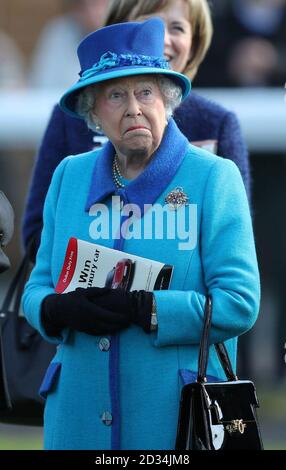 Queen Elizabeth II reacts after she watches her horse Musical Terms compete in the Dubai Duty Free Tennis Championships Maiden Stakes, as she attends the Dubai Duty Free Spring Trials and Beer Festival at Newbury Racecourse in Newbury. Stock Photo