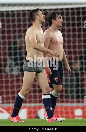 Red Star Belgrade's Marko Gobeljic (left) and Filip Stojkovic after the final whistle during the UEFA Europa League match at the Emirates Stadium, London. Stock Photo