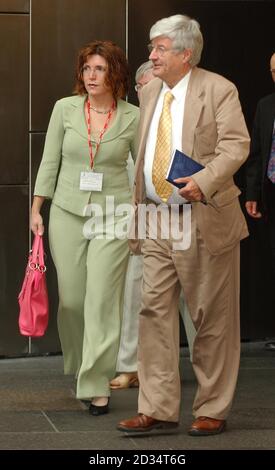 The US Consulate General Cecile Shea and Green MSP Robin Harper leave a meeting at the Scottish Parliament in Edinburgh. Stock Photo