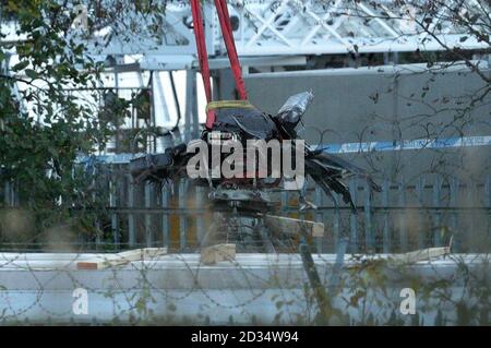 A crane moves part of the wreckage from the helicopter crash at Leicester City Football Club. Stock Photo