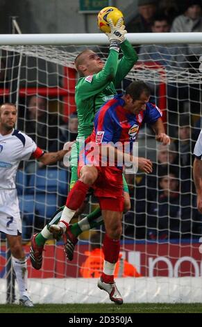 Crystal Palace's Shefki Kuqi and Colchester United goalkeeper Dean Gerken during the Coca-Cola Championship match at Selhurst Park, London. Stock Photo