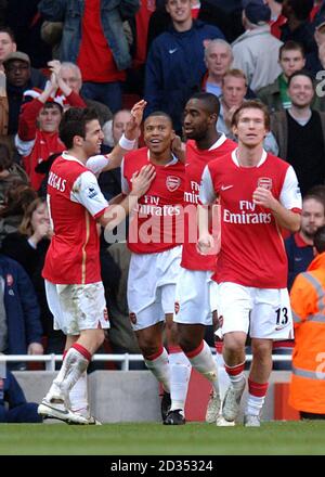 Arsenal's Cesar Julio Baptista celebrates with teammates after scoring the second goal Stock Photo