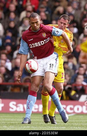 Liverpools'S Jamie Carragher and Aston Villa's John Carew (left) Stock Photo