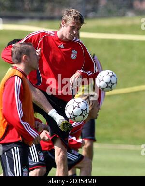 Liverpool's Peter Crouch and Craig Bellamy during a training session at Melwood, Liverpool. Stock Photo
