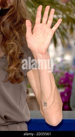 A close up of Angelina Jolies arm during a photocall for A Mighty Heart during the Cannes Film Festival. Picture date: Monday 21 May 2007. Photo credit should read: Anthony Harvey/PA Wire Stock Photo