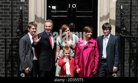 Prime Minister Tony Blair accompanied by his family (left to right) Euan, Kathryn, Cherie, Nicky, Front row: Leo, pose on the steps of No.10 as they leave Downing Street, London for the final time. Stock Photo