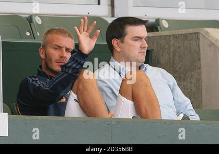 LA Galaxy's David Beckham sits with his Personal manager Terry Burn whilst his ankle is put in ice during a Friendly match at The Home Depot Center, Los Angeles, USA. Stock Photo