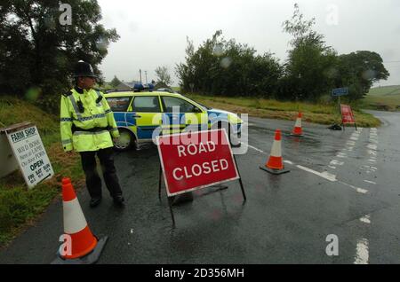 The scene of a helicopter crash near Gatebeck, in Cumbria in which four people died. The road to the site of the crash has been closed. Stock Photo