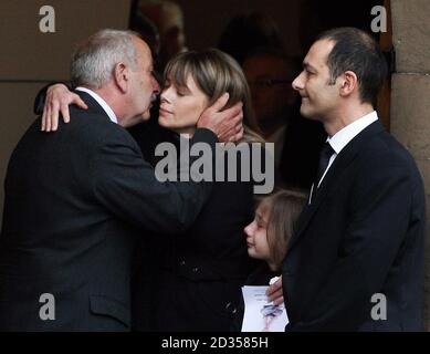 Karen (left) and Mark Porcelli (right) with daughter Carly depart the funeral of Ben Porcelli who died in a helicopter crash with rally driver Colin McRae, at Greyfriars Kirk, Lanark. Stock Photo