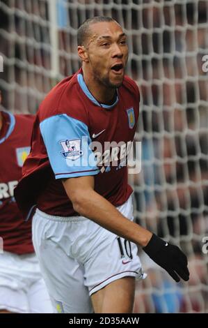 Aston Villa's John Carew celebrates after scoring the opening goal Stock Photo