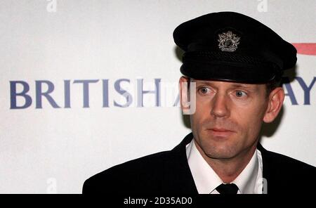 British Airways senior first officer John Coward as captain Peter Burkill, 43, reads out a statement about the crash-landing of the Boeing 777 at Heathrow. Stock Photo