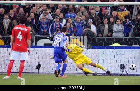 France's Franck Ribery scores a penalty past England goalkeeper David James during the International Friendly match at Stade de France, Paris, France. Stock Photo