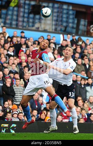 Aston Villa's John Carew and Bolton Wanderers' Gary Cahill battle for the ball Stock Photo