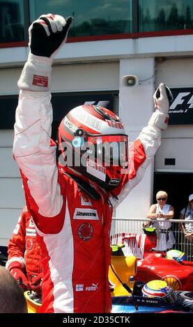 Ferrari's Finnish driver Kimi Raikkonen celebrates claiming pole position for the French Grand Prix at Magny-Cours, Nevers, France. Stock Photo