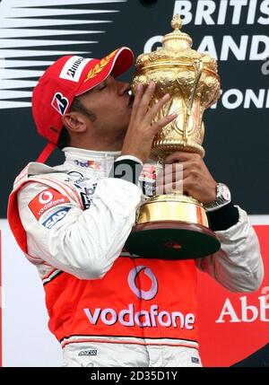 Mercedes' Lewis Hamilton Celebrating With The Trophy On The Podium At ...