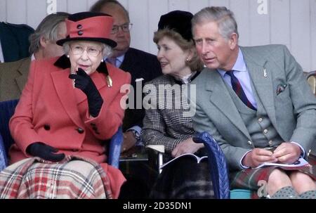 Britain's Queen Elizabeth II and the Prince of Wales attend the Braemar Gathering in Scotland.