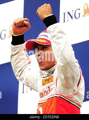 McLaren Mercedes' Lewis Hamilton of celebrates on the podium after winning the Belgian Grand Prix at Spa Francorchamps, Belgium. Stock Photo