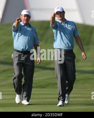 Europe's Justin Rose (right) talks with Miguel Angel Jimenez (left) during team practise at Valhalla Golf Club, Louisville, USA. Stock Photo