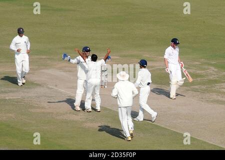 India's Amit Mishra celebrates after MS Dhoni caught England's Paul Collingwood for 11 during the third day of the second test at the Punjab Cricket Association Stadium, Mohali, India. Stock Photo