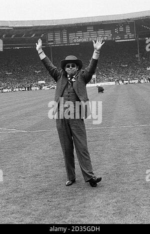 Watford chairman Elton John acknowledges the cheers of the crowd before the match Stock Photo