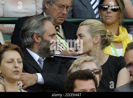 Kate Winslet and husband Sam Mendes in the Royal Box on Centre Courtduring the Wimbledon Championships at the All England Lawn Tennis and Croquet Club, Wimbledon, London. Stock Photo