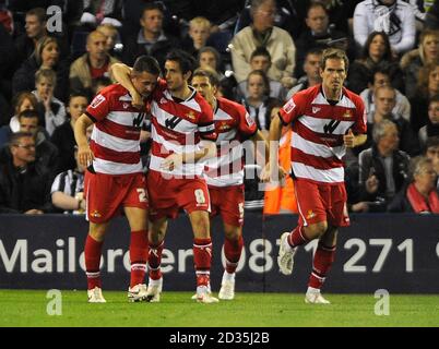 Doncaster Rovers' Waide Fairhurst (left) is congratulated by his team mates after scoring the opening goal of the game during a Coca-Cola Championship match at The Hawthorns, West Bromwich. Stock Photo