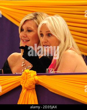 Olivia Newton John (left) and Susan George watch the HOYS Leading Show Jumper of the Year at the LG Arena, NEC, Birmingham. Stock Photo