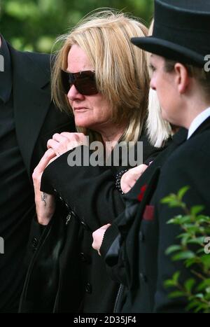 The mother of Guardsman Jamie Janes of the 1st Battalion Grenadier Guards, Jaqueline, watches his coffin leave St Philips Church in Hove, East Sussex, following his death in Afghanistan earlier this month. Stock Photo