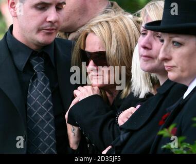 The mother of Guardsman Jamie Janes of the 1st Battalion Grenadier Guards, Jaqueline, watches his coffin leave St Philips Church in Hove, East Sussex, following his death in Afghanistan earlier this month. Stock Photo