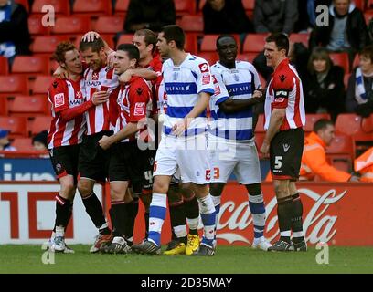 Sheffield United's Richard Cresswell (2nd left) is congratulated by his team mates after he scores the opening goal of the game during the Coca-Cola Championship match at Bramall Lane, Sheffield. Stock Photo
