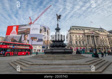 Westminster, London, UK. 7 October 2020. A Mackerel sky over a quiet Piccadilly Circus devoid of tourists, a harbinger of wet weather later in the day. Credit: Malcolm Park/Alamy Live News.