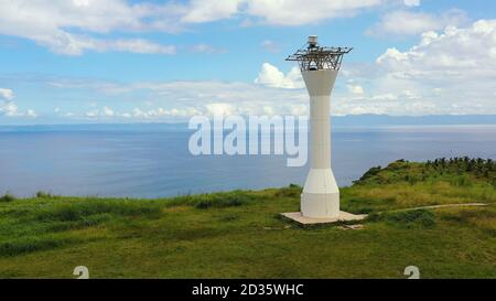 Basot Island, Caramoan, Camarines Sur, Philippines. Lighthouse on a hill by the sea,aerial drone. Beautiful landscape with a green island. Summer and travel vacation concept. Stock Photo