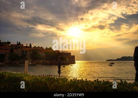 Sveti Stefan historical town island and resort at sunset. Budva riviera, Montenegro (Adriatic Sea), Europe. Travel concept, background. Stock Photo