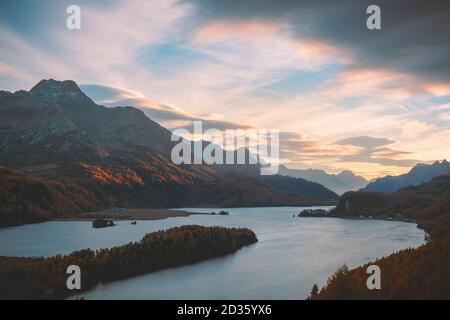 Aerial view on autumn lake Sils (Silsersee) in Swiss Alps mountains. Colorful forest with orange larch. Switzerland, Maloja region, Upper Engadine. Landscape photography Stock Photo